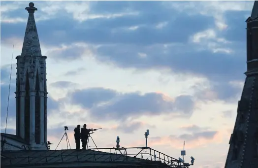  ??  ?? UNDER WATCH: FSO snipers secure Red Square during a concert in May. Now, the agents are monitoring unrest in economical­ly depressed regions.