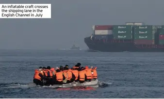  ??  ?? An inflatable craft crosses the shipping lane in the English Channel in July