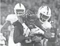  ??  ?? Arizona State quarterbac­k Manny Wilkins rushes for a touchdown vs. Stanford linebacker Bobby Okereke on Thursday.