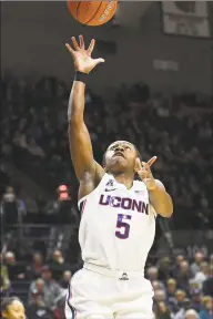  ?? Stephen Dunn / Associated Press ?? UConn’s Crystal Dangerfiel­d (5) shoots during the second half against California on Sunday in Storrs.