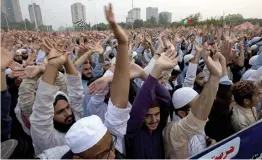 ?? — AP ?? Pakistan religious students and other protesters raise their hands to condemn Supreme Court’s decision in favour of Christian woman Asia Bibi in Islamabad on Wednesday.