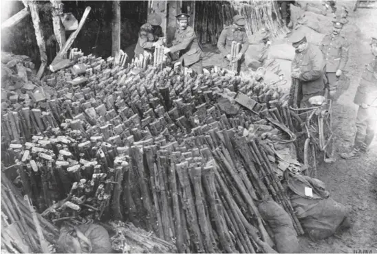  ??  ?? British troops stacking salvaged Lee-enfields at Aveluy, France, in September 1916 after the Battle of the Somme; they would be stripped, cleaned and reissued