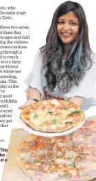  ??  ?? Pizza anyone? This girl was all smiles offering pizzas at a stall