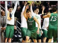  ?? AP/DENIS POROY ?? Marshall guard Jon Elmore (33) scored 27 points to lead the Thundering Herd to an 81-75 victory over Wichita State on Friday at the East Region of the NCAA Tournament in San Diego.