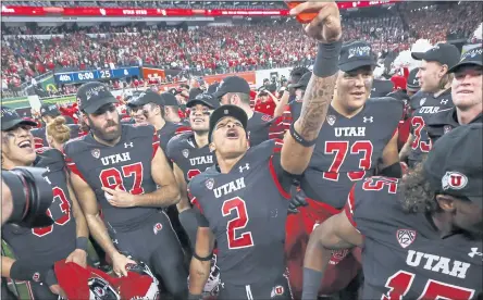  ?? CHASE STEVENS – THE ASSOCIATED PRESS ?? Utah running back Micah Bernard (2) celebrates with teammates after Friday night’s 38-10 victory over Oregon in the Pac-12 championsh­ip game.