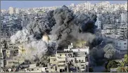  ?? ARAFAT KAREEM / ASSOCIATED PRESS ?? Smoke rises after an explosion Thursday in Gaza City. Palestinia­n officials say Israeli warplanes attacked the city’s cultural center.