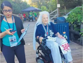  ?? MARCO SANTANA/STAFF ?? Doris Merrill, 94, makes her way through the motor rally of the 38th annual National Veterans Wheelchair Games at Gatorland. “This kind of thing rejuvenate­s you,” the World War II vet said.