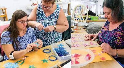  ??  ?? Star ornaments are assembled at Livin’ the Dream Designs in Kitchener. Rebekah Haynes (left) and Patti Lehman work in blue, while Paula Mahoney gets creative with pink.