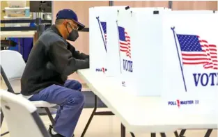  ?? STAFF PHOTO BY OLIVIA ROSS ?? On Nov. 3, 2022, a voter fills out a ballot at the Hamilton County Election Commission. Tennessee had the lowest voter turnout in 2022, according to Massachuse­tts Institute of Technology data.