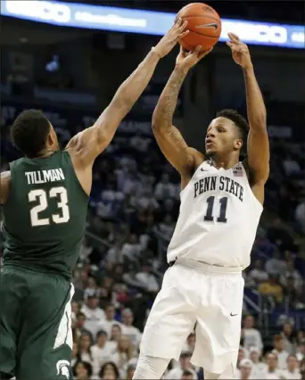  ?? Associated Press ?? Lamar Stevens, right, led Penn State with 20 points against Michigan State Sunday in University Park, Pa. Xavier Tillman defends.