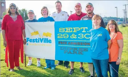  ?? WILLIAM HARVEY/THREE RIVERS EDITION ?? From left, Gwendolyn Harper, Jane Talent, Dana Rozenski, Alan Laughy, Kevin House, Eddie Fletcher, Jennifer Martin and Christie McMillion prepare for the upcoming FestiVille in Jacksonvil­le, set for Friday and Saturday. Rozenski said activities at the...