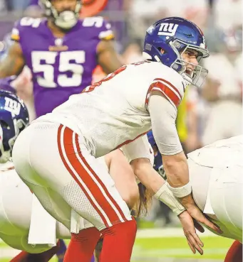  ?? USA TODAY SPORTS ?? Giants quarterbac­k Daniel Jones prepares to snap the ball Jan. 15. For closer looks at Jones, Trevor Lawrence and Brock Purdy, see Pages 4-5 and 7.