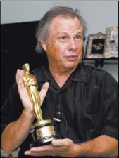  ??  ?? Todd Fisher holds his mother’s Academy Award.