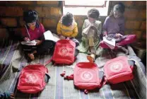  ?? ?? Rajkumari Ratnavati girls’ school pupils study at their house.