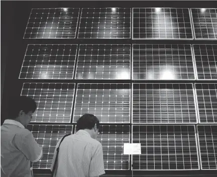  ?? TOSHIFUMI KITAMURA/AFP/ GETTY IMAGES FILES ?? Solar cell modules used at solar power plants are on display at the Kawasaki EcoLife Museum for the Future in Kawasaki, south of Tokyo. Japan may not remain the No. 2 solar market after China beyond next year as it shifts from mega-solar to rooftops.