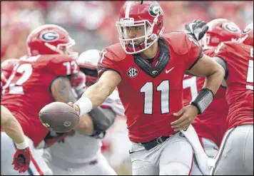  ?? BRANT SANDERLIN / BSANDERLIN@AJC.COM ?? Former Virginia quarterbac­k Greyson Lambert had a solid 2015 season for Georgia, throwing for 1,959 yards, 12 touchdowns and just two intercepti­ons while posting a 10-2 record.