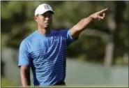  ?? JULIE JACOBSON — THE ASSOCIATED PRESS ?? Tiger Woods motions while chipping onto the third green during a practice round for the U.S. Open Golf Championsh­ip, Tuesday in Southampto­n, N.Y.