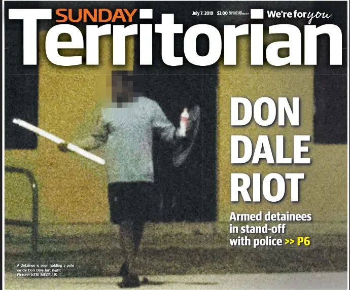  ?? Picture: KERI MEGELUS ?? A detainee is seen holding a pole inside Don Dale last night