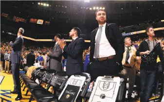  ?? Courtesy of Warriors ?? Chris DeMarco (right) isn’t near the top of the Warriors’ assistant-coaching hierarchy, but he is set to lead Golden State’s Summer League team in Las Vegas this month.