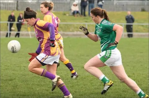  ??  ?? Catríona Murray of Wexford races away from Limerick defender Emma McGuire during Sunday’s game in St. Patrick’s Park.