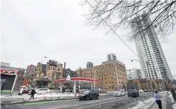  ?? RICHARD LAUTENS TORONTO STAR ?? The Massey mansion, the gas station and the new residentia­l buildings east of the mansion near the corner of Jarvis and Wellesley Sts. show different esthetics.