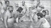  ?? PHOTO: PTI ?? Shankarach­arya Swami Swaroopana­nd Saraswati takes dip during Kumbh in Haridwar on Friday.