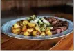  ?? ALDRIDGE PHOTOGRAPH­Y ?? Meals are served family-style during Farm To Table Dinners at Lakota’s Farm.