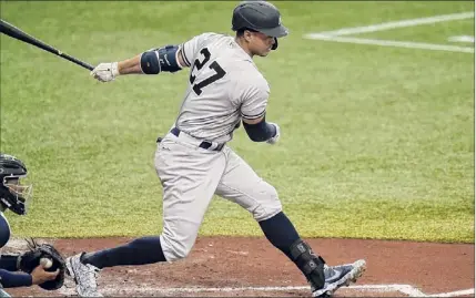  ?? Chris O’meara / Associated Press ?? The Yankees’ Giancarlo Stanton strikes out against Rays relief pitcher Andrew Kittredge during the third inning Saturday. Stanton went 0-4 with two strikeouts in the game.