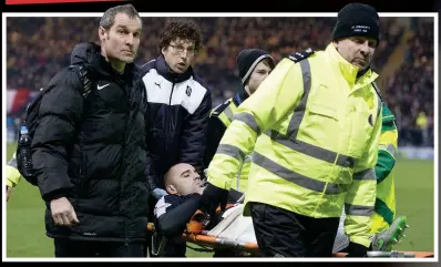  ??  ?? Long way back: McPake (left) is stretchere­d off in the Dundee derby in January 2016 with a fractured kneecap but after four operations, multiple injections, long periods with a leg brace and eight hours a day on a machine, the Dundee defender has been given the green light to get his boots back on and can’t wait for his daughters to see him in action