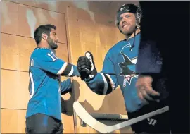  ?? NHAT V. MEYER — STAFF PHOTOGRAPH­ER ?? 49ers quarterbac­k Jimmy Garoppolo, left, high-fives the Sharks’ Joe Pavelski before the the start of Game 3 against the Vegas Golden Knights on Monday night at SAP Center.