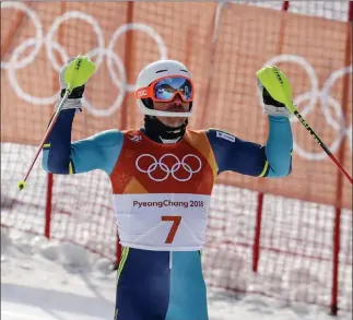  ?? Morry Gash ?? The Associated Press Swedish skier Andre Myhrer celebrates after winning the Olympic men’s slalom gold medal.