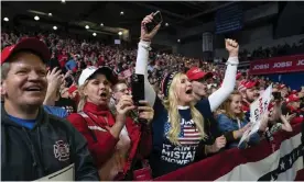  ??  ?? Trump cheer supporters cheer as he arrives to speak at a campaign rally in Des Moines, Iowa, on Thursday. Photograph: Evan Vucci/AP