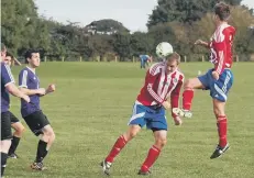  ??  ?? Tommy Wilson on the ball, top, and Matty Pearson wins a header, above