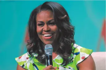  ?? CITIZEN NEWS SERVICE PHOTO BY GERALD HERBERT ?? Former first lady Michelle Obama speaks at the American Library Associatio­n annual conference in New Orleans last June. Obama is launching a book tour to promote her memoir Becoming.