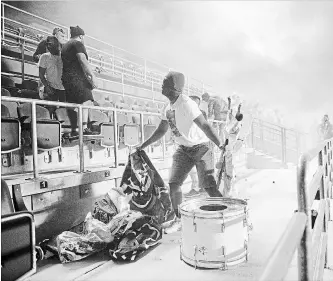  ?? CANADIAN PRESS FILE PHOTO ?? Toronto FC fans are ejected from the stadium after a flare was thrown onto the field last Wednesday in Ottawa. BMO Field will have a different look Wednesday as a result of TFC sanctions against its supporters’ groups.