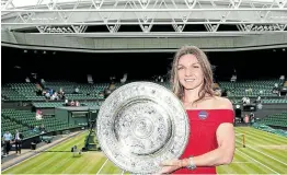  ?? Picture: GETTY IMAGES ?? DEFENDER: Simona Halep poses with the trophy after defeating Serena Williams in the 2019 Wimbledon women's singles final