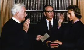  ?? Bibles. Photograph: AP ?? Sandra Day O’Connor being sworn in as the first female justice of the supreme court by Chief Justice Warren Burger in Washington, 1981. Her husband John is holding the family