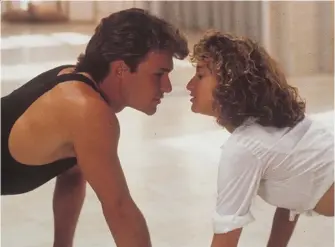  ?? PHOTOS: NORSTAR RELEASING ?? The late Patrick Swayze, left, and Jennifer Grey starred in the surprise hit Dirty Dancing. Co-star Kelly Bishop says the cast originally thought the 1987 film would not be a box office success.