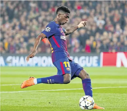  ??  ?? Barcelona’s Ousmane Dembele scores against Chelsea.