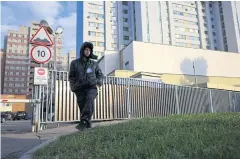  ?? AFP ?? A security guard patrols outside a building that houses the Nato informatio­n office in Moscow on Monday.