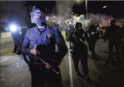  ??  ?? PROTESTERS WHO were injured denied that the officers were in any real physical danger when they lashed out. Above, officers on Glendale Avenue.