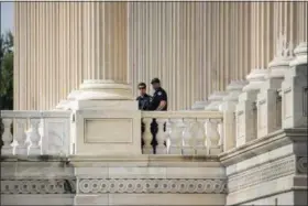  ?? THE ASSOCIATED PRESS ?? Capitol Hill Police officers stand watch outside the House of Representa­tives on Capitol Hill in Washington, Thursday, June 15, 2017, a day after a gunman opened fire on a lawmakers.