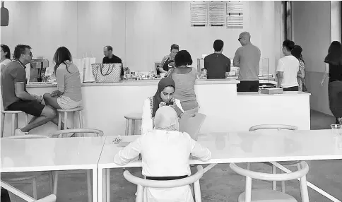  ??  ?? The interior of Blue Bottle in Georgetown is designed to eliminate all distractio­ns. — WP-Bloomberg photos