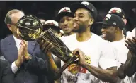  ?? Ezra Shaw / TNS ?? Kawhi Leonard of the Toronto Raptors celebrates with the Larry O’Brien Championsh­ip Trophy after his team defeated the Golden State Warriors to win the NBA title on June 13. Leonard and Paul George were added to the Clippers’ roster after the season ended.