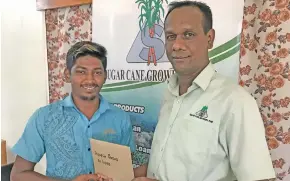  ?? Photo: Shratika Naidu ?? Sugar Cane Growers Fund Labasa loans officer Arvin Chandra (right) with Avinesh Prasad in Labasa on February 11, 2020.