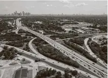  ?? Jon Shapley / Staff photograph­er ?? Interstate 45 crosses Loop 610, near Independen­ce Heights, lower right, as traffic passes by on July 5, 2019.