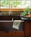  ?? HOUZZ ?? Sinks get a hard makeover with the use of concrete, stone and even granite in darker shades.
