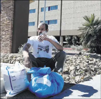  ??  ?? Carlos Sanchez gathers his belongings Friday after his discharge from North Vista Hospital’s psychiatri­c ward. He was there after a suicide attempt. “They thought I was homeless,” Sanchez said.