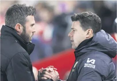  ?? Picture: Getty Images ?? ANOTHER DEFEAT. Chelsea manager Mauricio Pochettino (right) and his Middlesbro­ugh counterpar­t Michael Carrick shake hands after the League Cup semifinal at the Riverside Stadium.