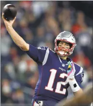  ?? Michael Dwyer / Associated Press ?? Patriots quarterbac­k Tom Brady passes under pressure from the Chiefs in an Oct. 14 game.